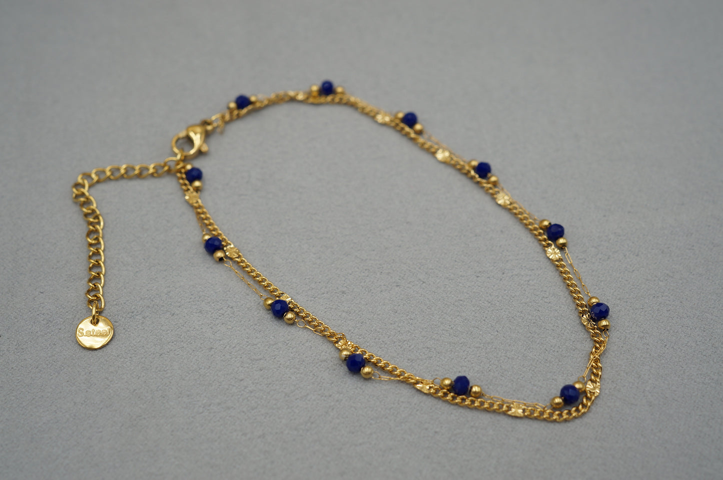 cavigliera a doppio filo con perline